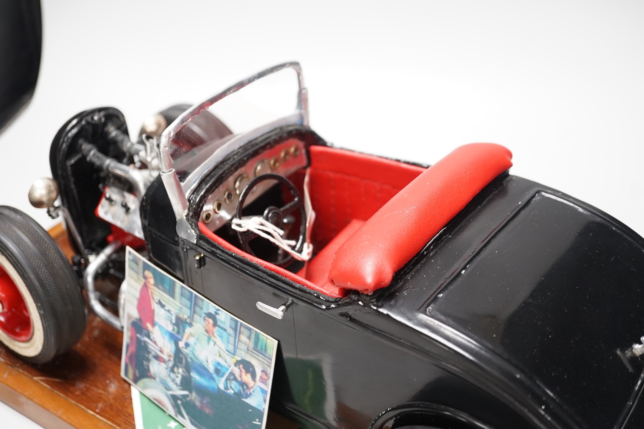 A scratch built model of Elvis Presley's Ford Coupe. 49cm wide
